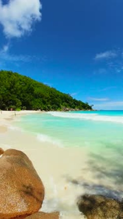 Rocky Tropical Coastline with Turquoise Ocean Waves