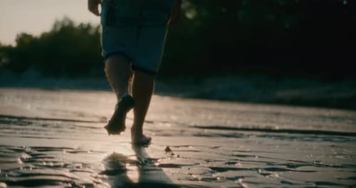 Man Walking on Dry Earth River Alone Man Footsteps Footprints