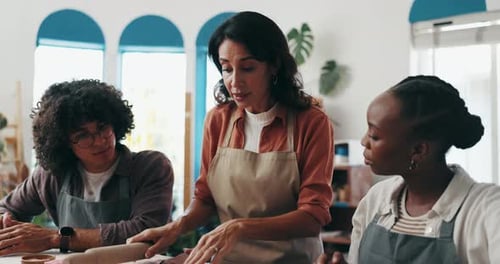 Pottery, teaching and woman with people in art workshop for skills with clay
