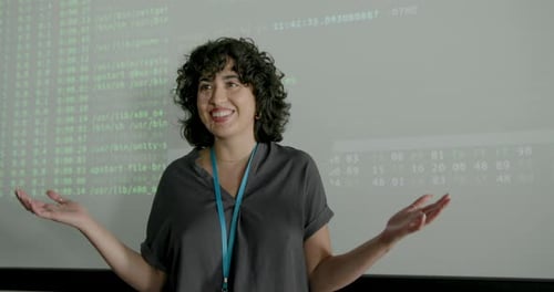 Female Young Adult Engineer Presenting in Office using Projection Screen