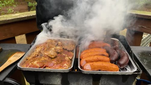 Barbecue Grilling Meat and Sausages Outdoors