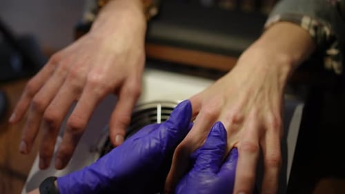 High Angle View Female Hands in Gloves Massaging Male Palms in Slow Motion Closeup Unrecognizable