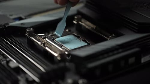 Applying Thermal Paste on Computer CPU Socket