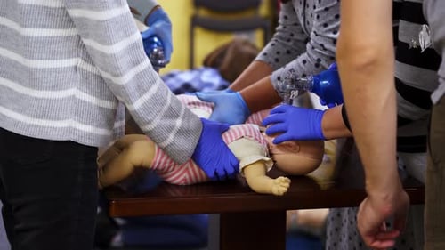 CPR Training on Doll at Medical Workshop