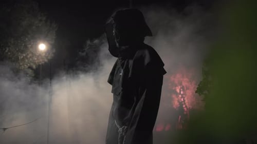 Silhouette Of a Monk With Monster Face Walk in the Night Forest for Halloween