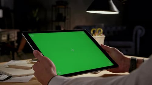 Green Screen and Chroma Key of Tablet Computer. Business Man Holding Mobile