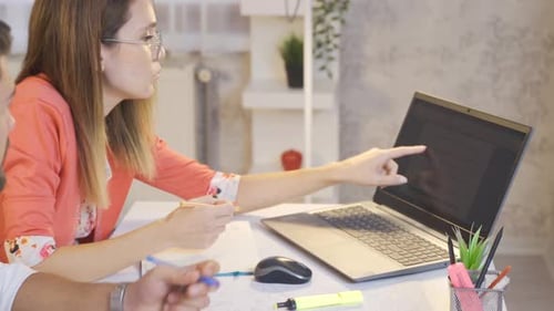 University students work at home with laptop and looking at books.
