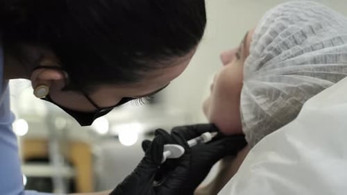 Woman Receiving Cosmetic Injection at Medical Facility