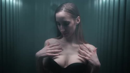 Attractive Sexy Slim Brunette Girl Touches Her Tits Collarbone and Neck with Her Fingers