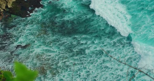 Ocean Power Beach Surf Clear Water Wide Sea Wave with White Foam Splash Washing Rocky Shore Energy
