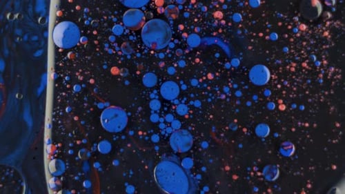 Orange and Dark Blue Drops Swirl Space Stars and Planets Concept