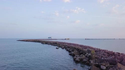 Aerial view of large white cruise liner Seven Seas Splendor arriving at the port of Liepaja (Latvia)