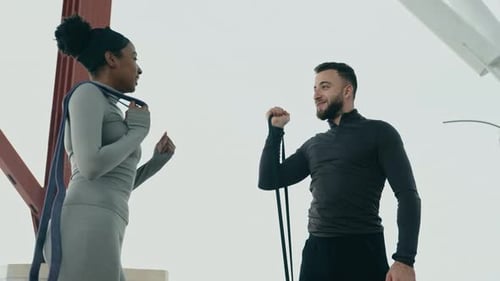 Outdoor Fitness Training Young Multiethnic Athletes Using Resistance Bands