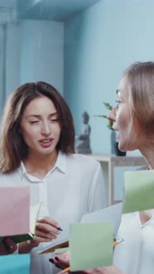 A Colorful Team Meeting Featuring Sticky Notes is Perfect for Brainstorming and Detailed Planning