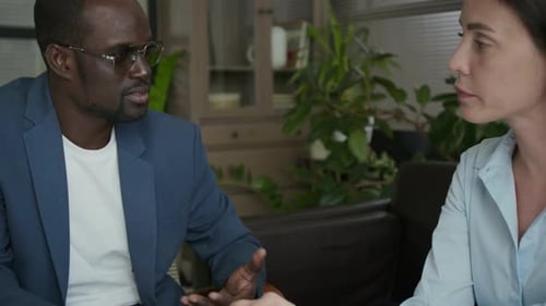 Male Counsellor Supporting Female Client and Touching Her Hands