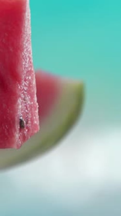 Flying of Watermelon and Slices in Blue Beach Background