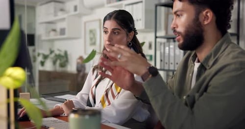 Young Adults Working Together in a Modern Office