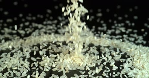Rice falling against Black Background, Slow motion 4K