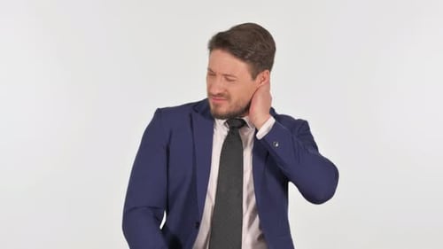 Man Rubs Neck in Discomfort and Stress