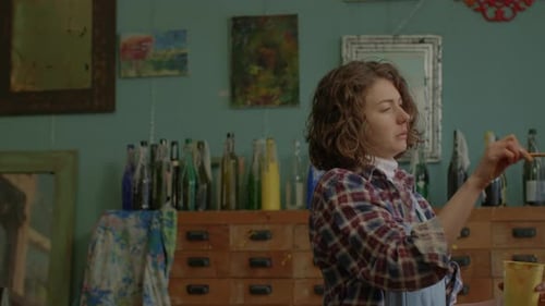 Female Artist Painting in her Studio