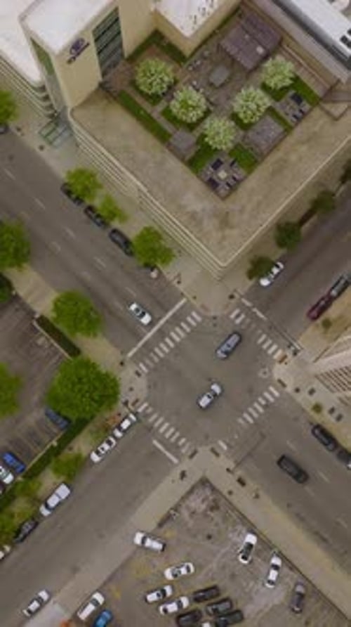Cars crossing the crossroads in the Chicago downtown. View of the city roofs and parking lots