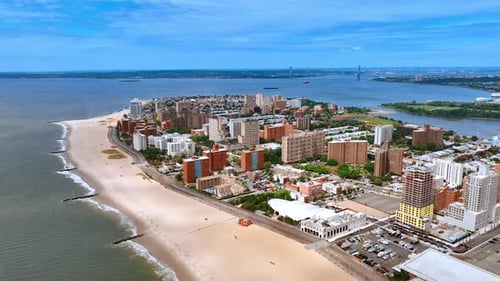 Sandy beach and residential area in Coney Island, Brooklyn, NY, USA.