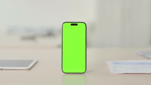 Smartphone with Green Screen on Desk