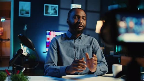 Man Records Video Blog in Home Studio