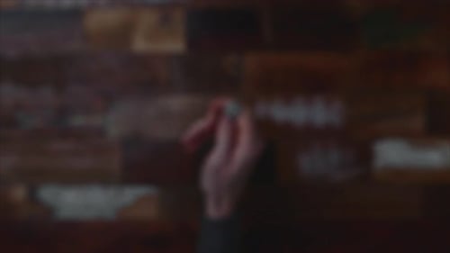 Blurry Shot Of Hand Throwing Coin In Focus. overhead