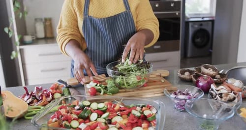 Woman Preparing Salad in Kitchen