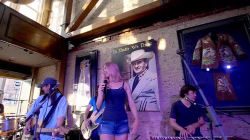 Live music echoes through a nashville Tennessee honky tonk bar at night
