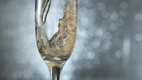 Champagne Pouring into a Sparkling Glass, Bubbles Rising