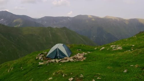 Tent on Mountain Hillside with Scenic Views