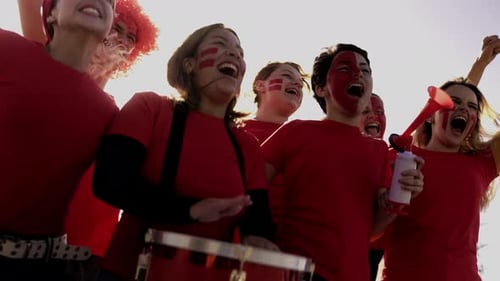 Crowd Red sport football fans celebrating final champion on stadium tribune - Soccer league