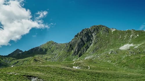 Scenic Mountain Landscape with Hiking Trail on Sunny Day