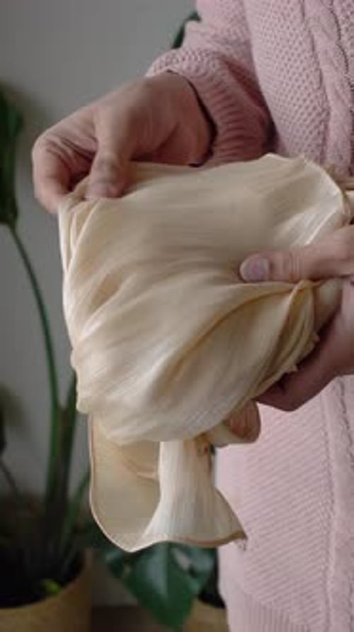 Holding Silk Fabric in Hands at Home Kitchen