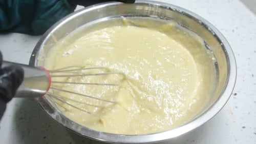 Close Up Mixing Batter with Whisk in Bowl