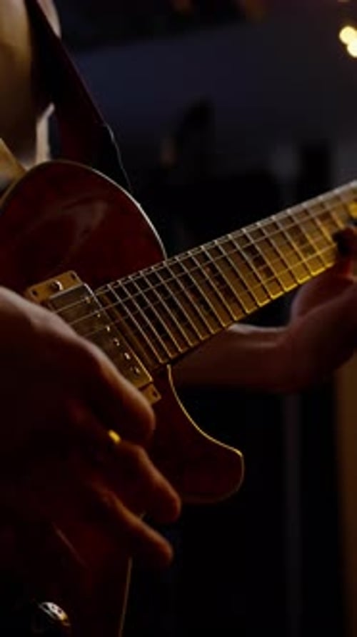 Guitarist Plays Electric Guitar in Close Up
