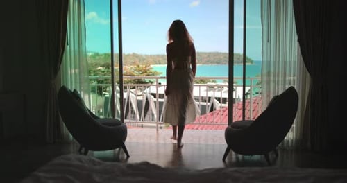 Woman Slowly Walking on Balcony Enjoy Ocean View