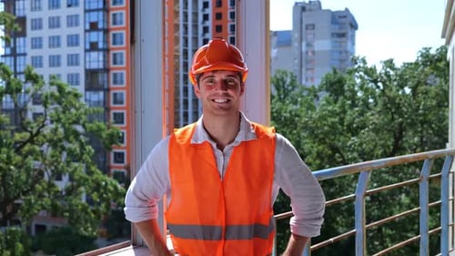 Smiling Construction Worker on Balcony