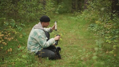 Nature Explorer Positions Camera to Capture Scenic View Enthusiastic Hiker Carefully Arranges