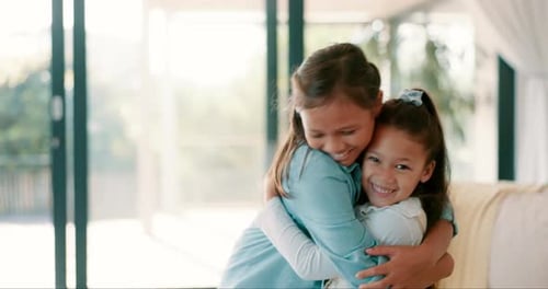 Two Young Girls Sharing a Loving Embrace