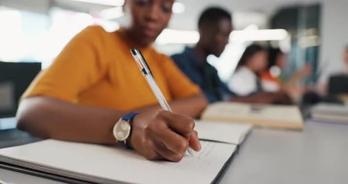 Notebook, hands and woman in classroom for writing, studying or assignment at university