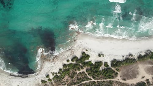 (Top down view) Aerial view drone over beach sea with powerful sea waves. Beach sand and amazing sea