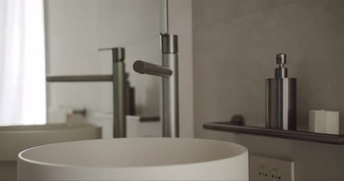Modern Bathroom Interior with Round Sink and Faucet