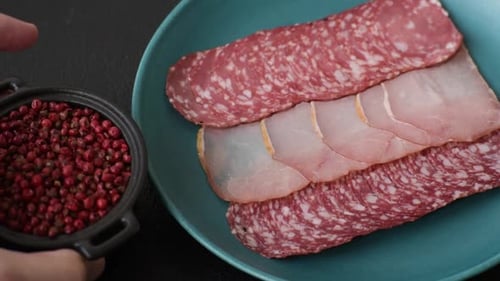 Delicious Sliced Charcuterie Served on Plate with Spices