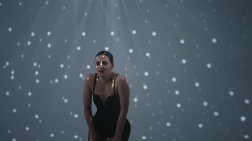 Seductive Woman In Black Suit Dancing Passionately In Studio Medium Portrait In Motion