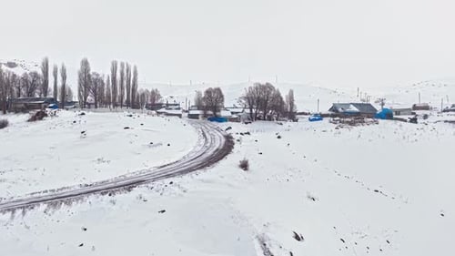 Snow Covered Mountain Village Aerial View