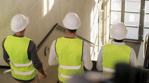 Architecture, Construction Business and People Concept - Male Architects in Helmets With