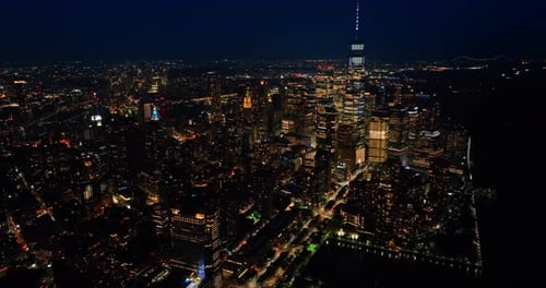 Glamorous New York scenery at night. Metropolis shining with billions of lights. Aerial view.